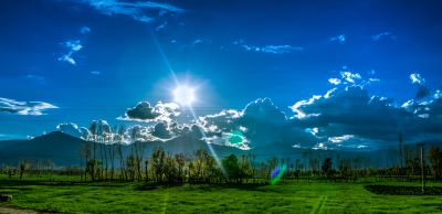 fluffly white clouds and blue skies